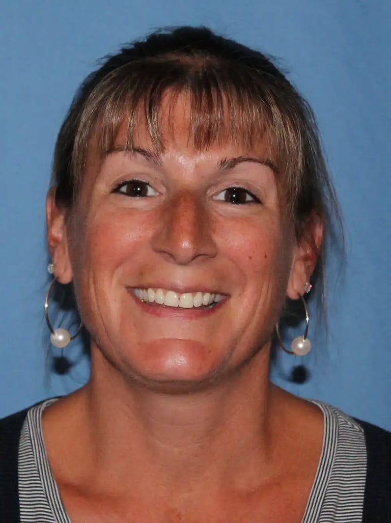 Woman with earrings and blue background