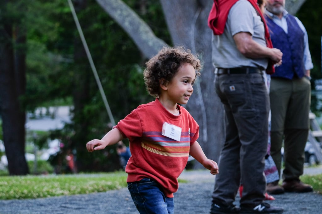 child running around campus on alumni weekend