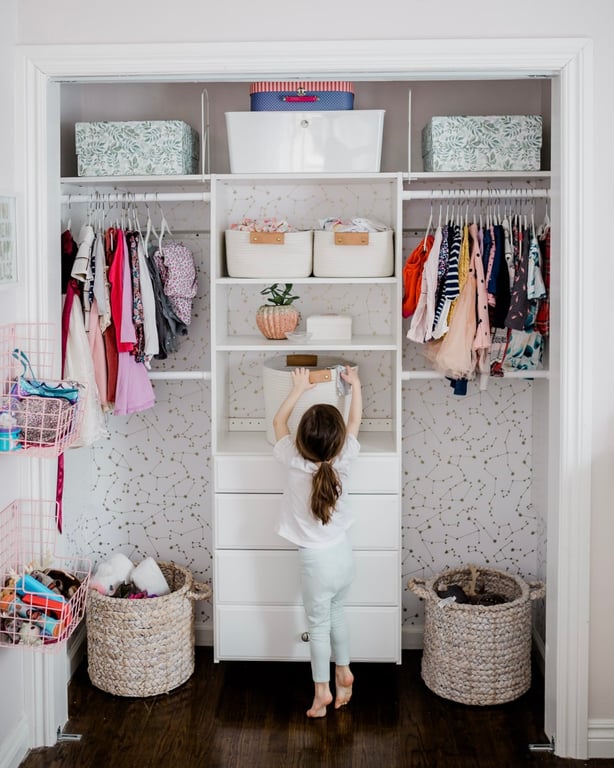 Maximized vertical storage with double-hang rods and adjustable shelving.