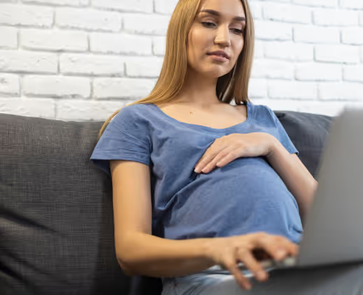 pregnant woman holding her belly