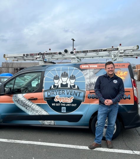 Chuck Breidenbach, Dryer Vent Squad franchisee, beside a branded service van
