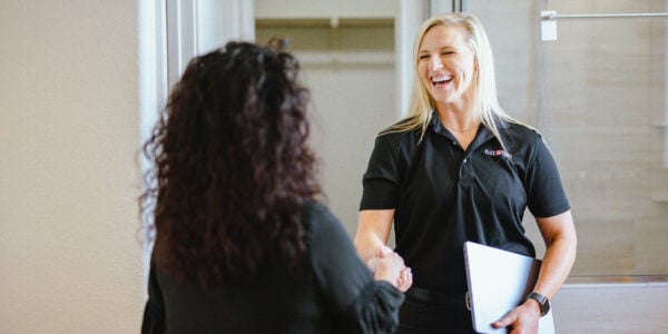 Clozetivity team member and client sharing a friendly handshake