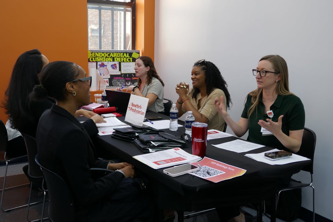 Students and employer representatives at a CAHE career and job fair on campus.