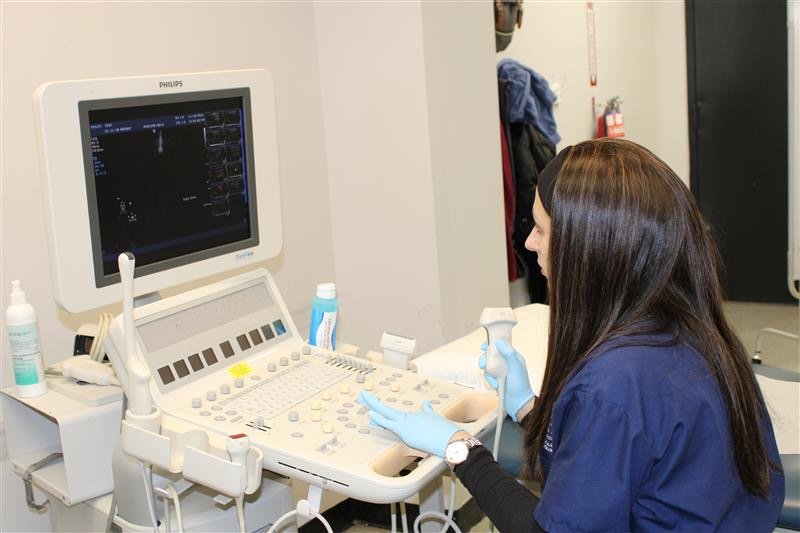 Students practice ultrasound scanning techniques in the diagnostic medical sonography lab.