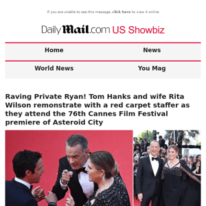 Raving Private Ryan! Tom Hanks and wife Rita Wilson remonstrate with a red carpet staffer as they attend the 76th Cannes Film Festival premiere of Asteroid City
