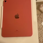 Apple iPad 10th gen (coral red) with Apple Pencil. 