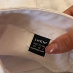 White cargo mini skirt in size UK XS (EU 34 / US 2).