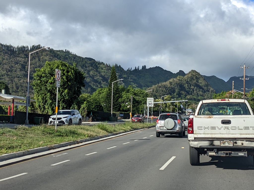 Image with caption 'I decided to drive to a beach on the east side of the island. So far, I'd only seen the city-like parts of O'ahu so far. Here, it was starting to feel like mountains (and the destination turned out to be quite suburban).'