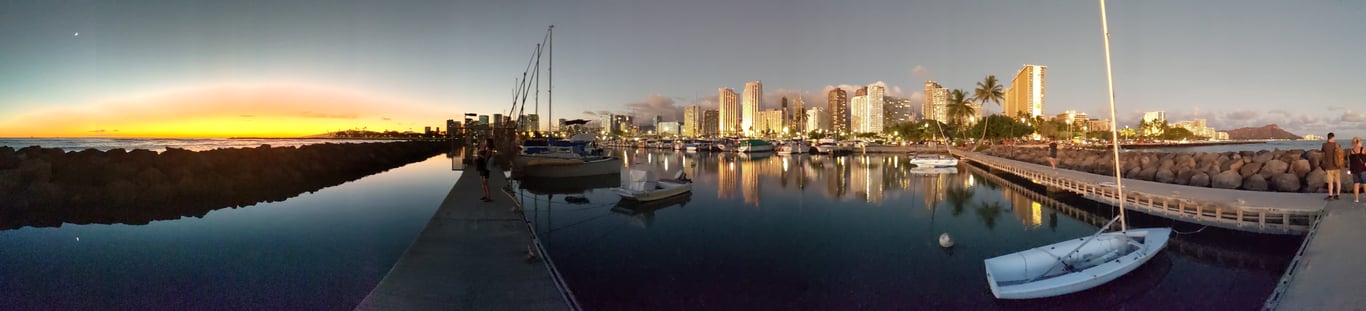 Image with caption 'It was a really nice sunset for my first night on island! This was taken from the dock in Ala Wai Boat Harbor.'
