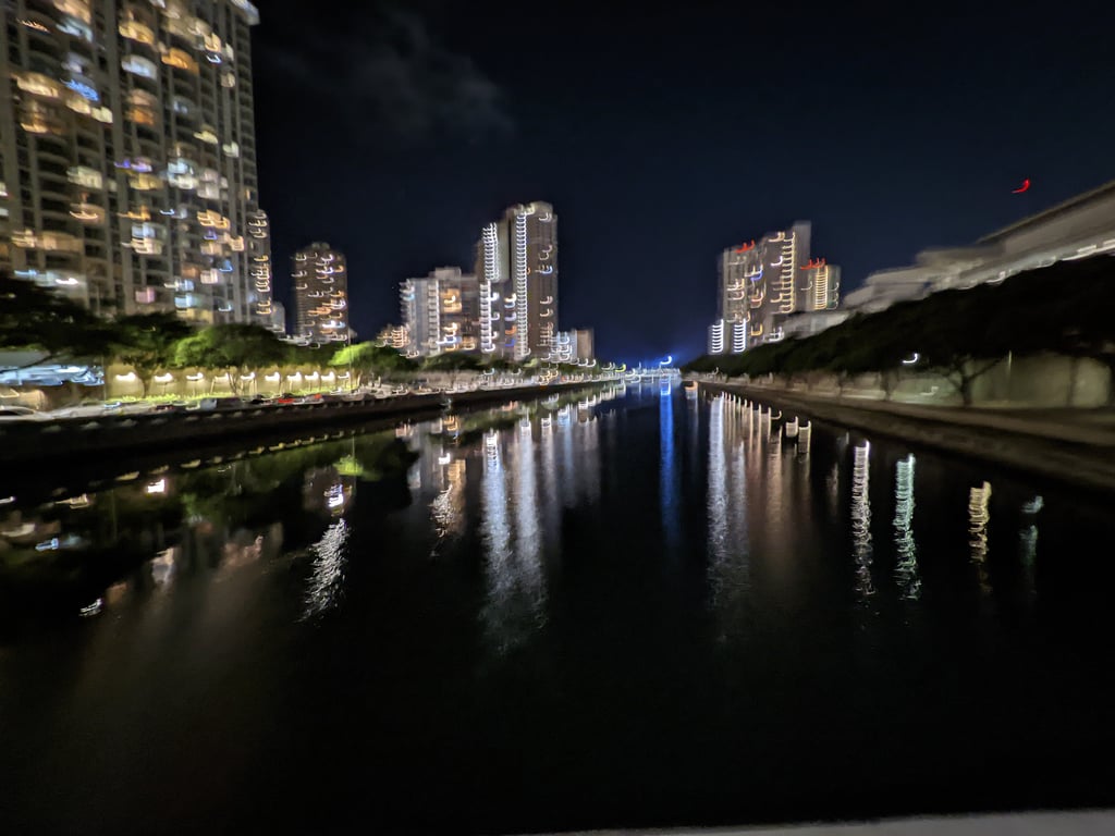 Image with caption 'A waterfront view of the city (pardon the blurriness).'