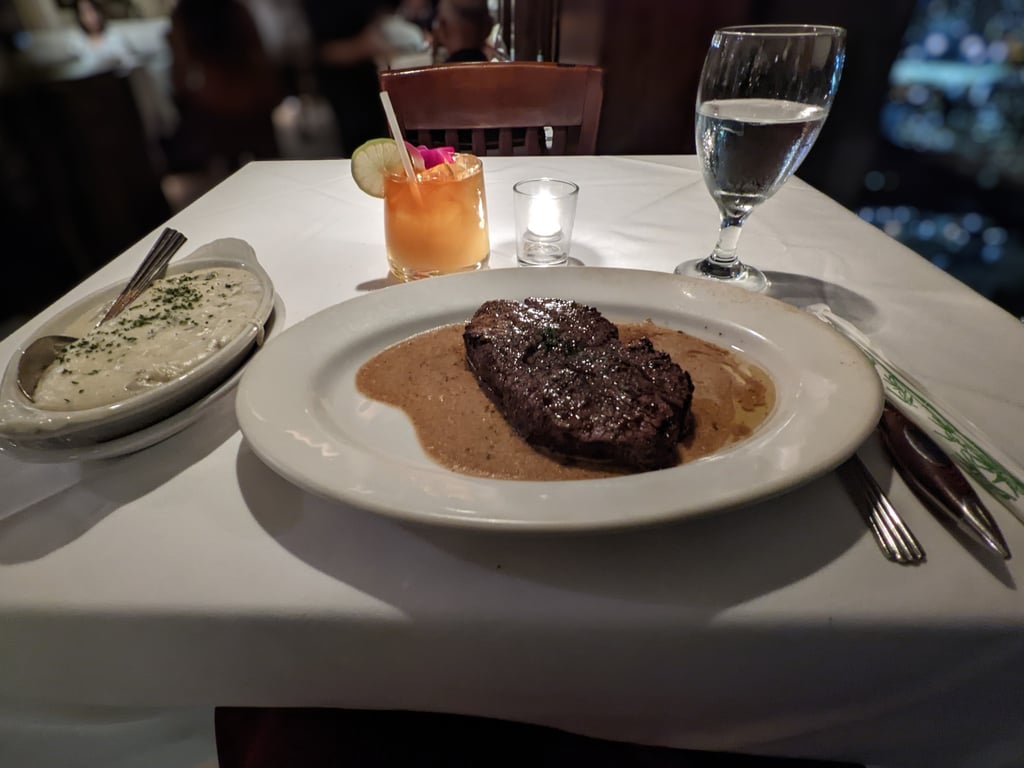 Image with caption 'My entrée: the steak, which came with a side of mashed potatoes.'
