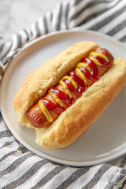 Keto hot dog in a golden bun topped with mustard and ketchup