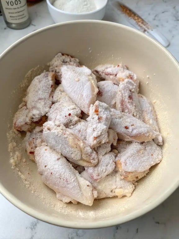 Step 2 for air fryer chicken wings — process in progress