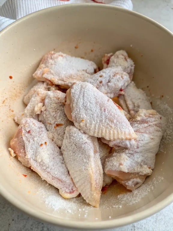 Step 2 for air fryer chicken wings — process in progress