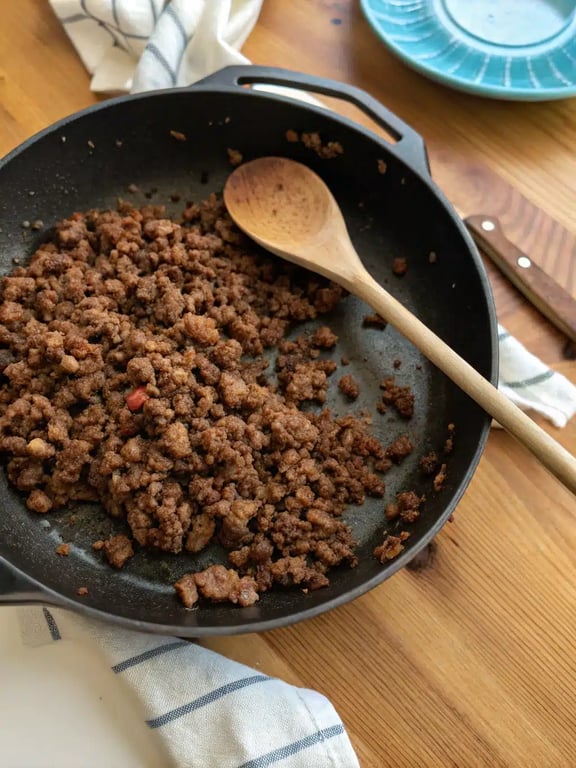 Step 2 for air fryer chimichangas — process in progress