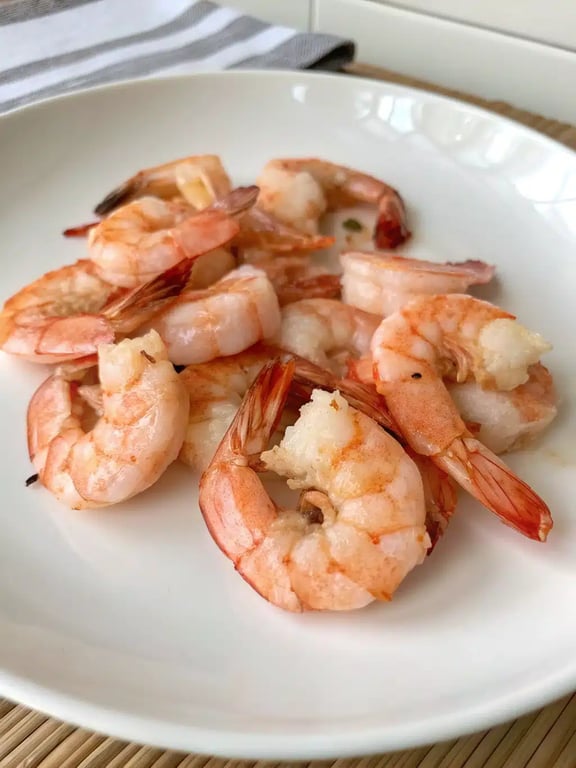 air fryer shrimp plated with rice and vegetables as a complete meal