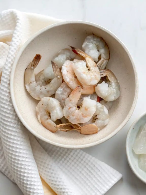 Step 2 for air fryer shrimp — process in progress
