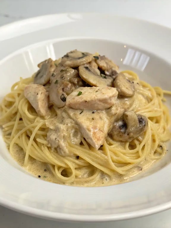 crockpot angel chicken beautifully plated with fresh parsley garnish