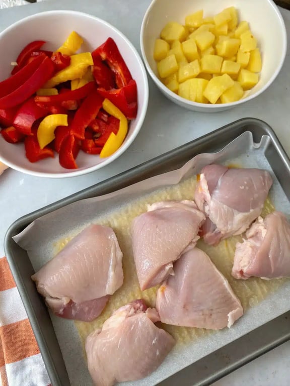 Step 2 for Sheet Pan Hawaiian Chicken — process in progress