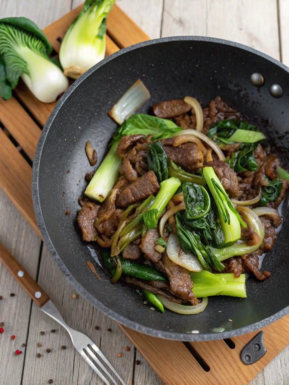 Final plated bok choy beef stir fry served in a bowl with rice
