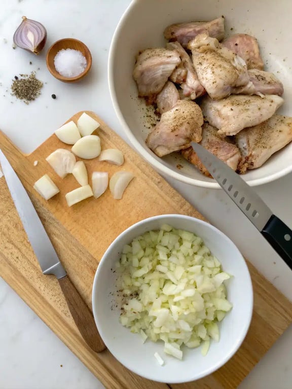 Step 2 for fall dinner ideas — cooking onions and chicken in a Dutch oven