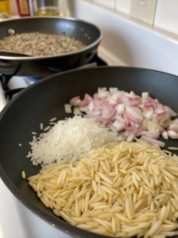 Step 2 for orzo dinner recipe — sautéing onions and garlic in a skillet