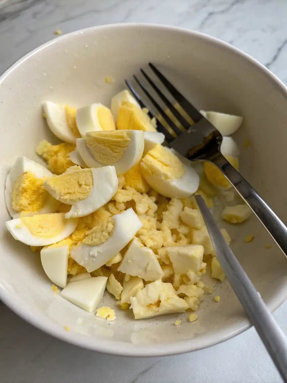 Step 2 for cottage cheese egg salad — process in progress
