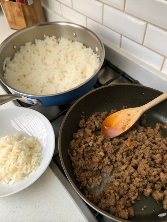 Step 2 for taco rice bowl showing ground beef browning in a skillet