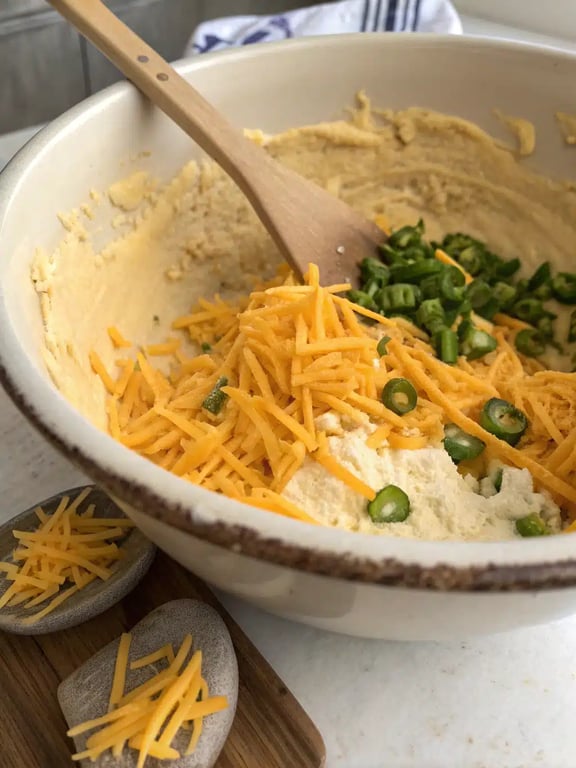 Step 4 for cheddar jalapeño waffles — texture check