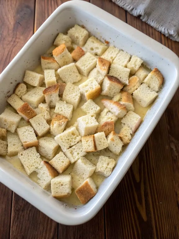 Step 2 for baked french toast casserole — process in progress