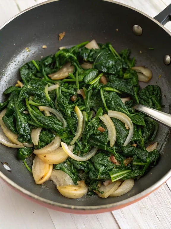 Step 2 for crustless spinach quiche — process in progress