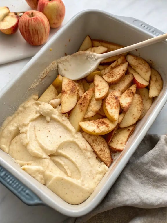 Final step for apple cobbler recipe — a baked cobbler, golden and bubbling, ready to serve