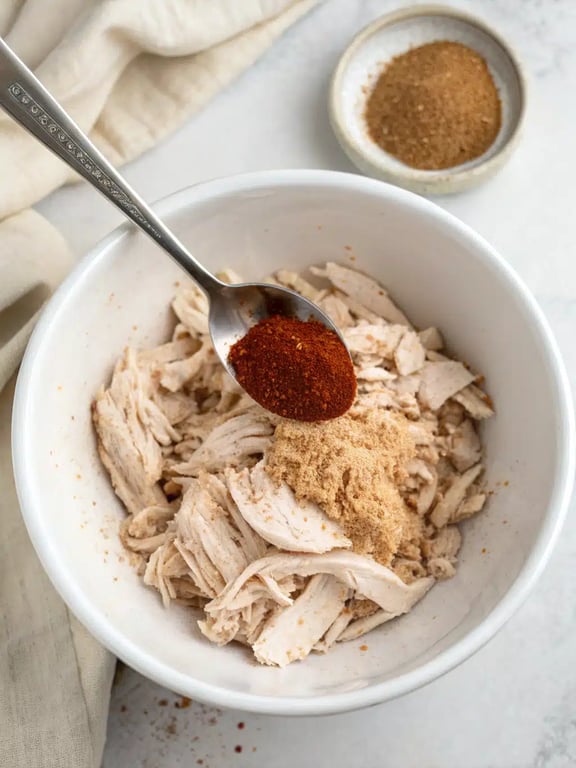 Step 2 for rotisserie chicken tostadas — process in progress