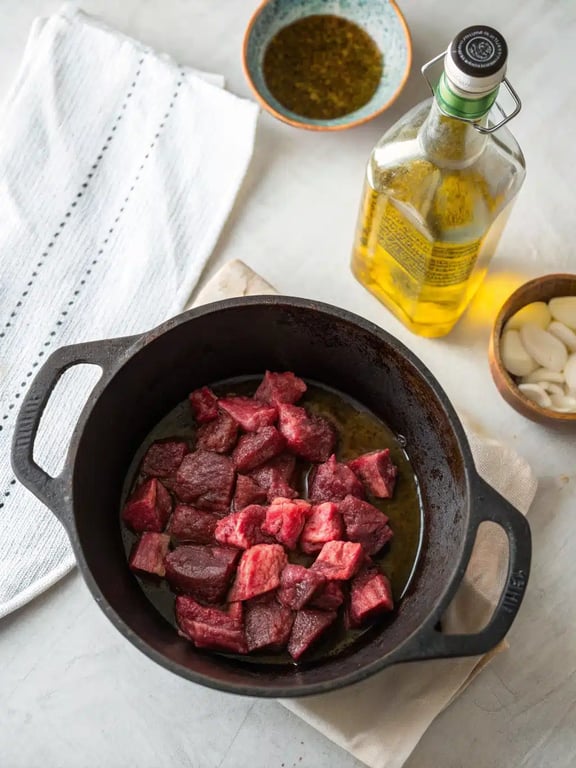Cooking the aromatic vegetables for beef potato soup in a Dutch oven