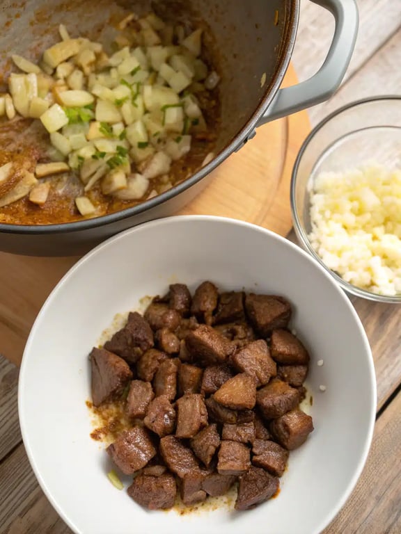 Step 4 for beef stew recipe — adding broth and scraping pot