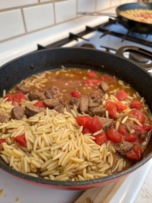 Step 4 for ground beef orzo — texture check
