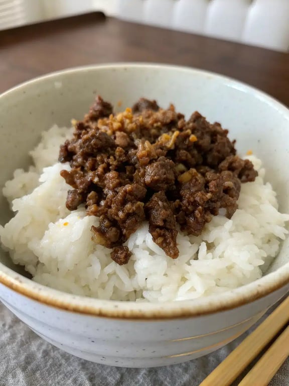 Korean ground beef beautifully plated with rice and green onion garnish