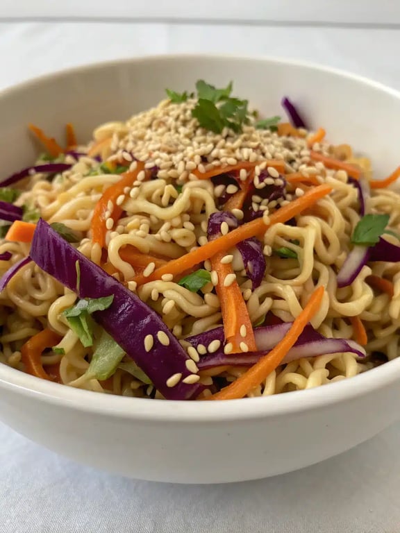 Asian ramen noodle salad plated elegantly with grilled chicken