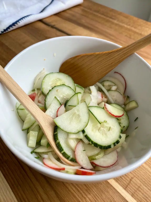 Final step for cucumber apple salad, beautifully plated and ready to serve