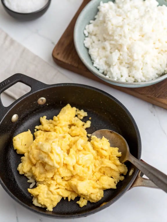 Step 2 for egg fried rice — process in progress