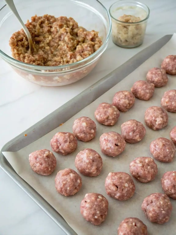 Step 4 for Italian meatball recipe — browning meatballs in a pot