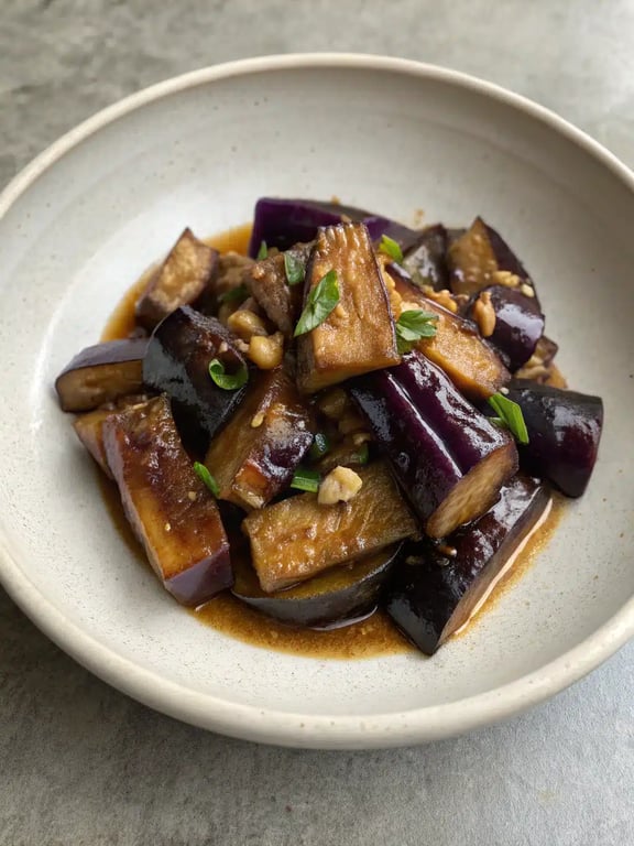 Chinese eggplant garlic sauce served with steamed rice in a bowl
