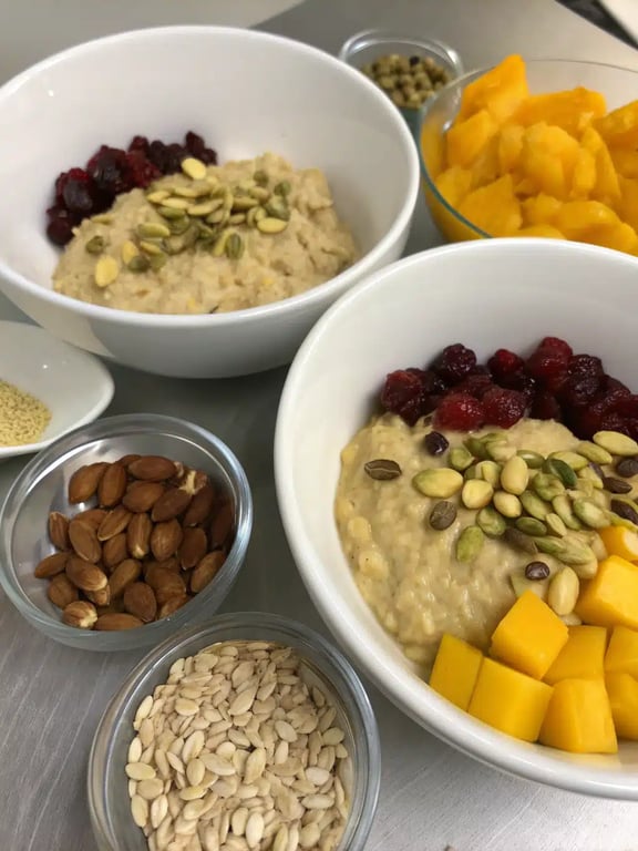 Finished bowl of Indian overnight oats with nuts and pomegranate