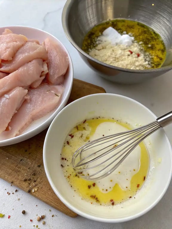 Step 2 for Mediterranean chicken tenders — process in progress