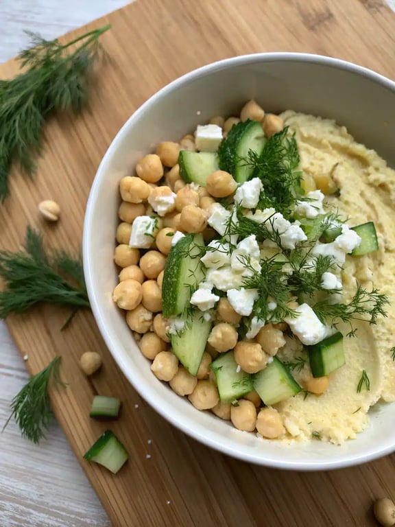 Warming a tortilla in a skillet for the Mediterranean chickpea wrap