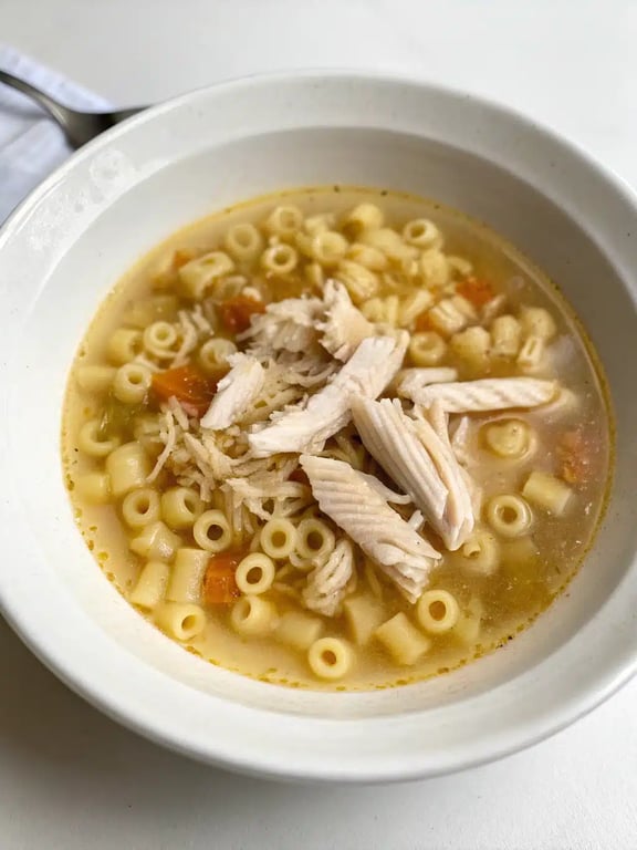 Italian Penicillin Soup served with bread Italian Penicillin Soup served in a bowl with crusty bread on the side