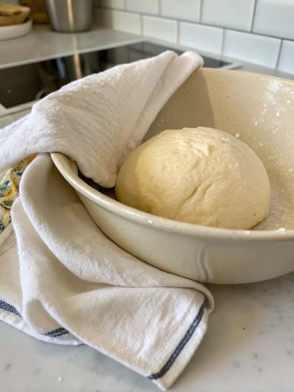 homemade pizza recipe — step 4 Step 4 for homemade pizza recipe — stretching the dough into a circle