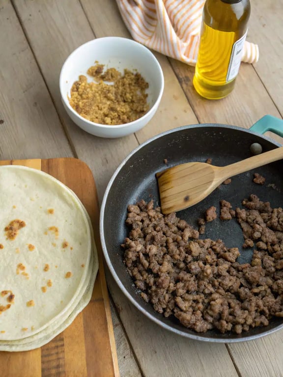 Step 2 for Mexican pizza recipe — frying tortillas until golden and crisp