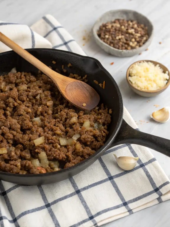 Step 2 for easy family dinner casseroles — whisking the creamy sauce in a bowl
