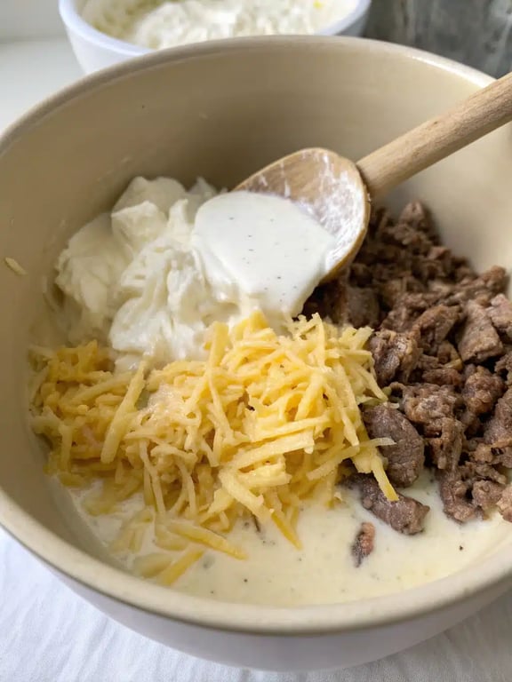 Step 4 for hamburger hashbrown casserole — texture check